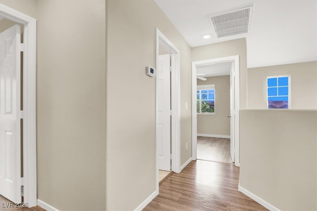 636 Pacific Cascades Drive Henderson, NV 89012 - Photo 35 of 51 Hallway with light wood-style flooring and recessed lighting