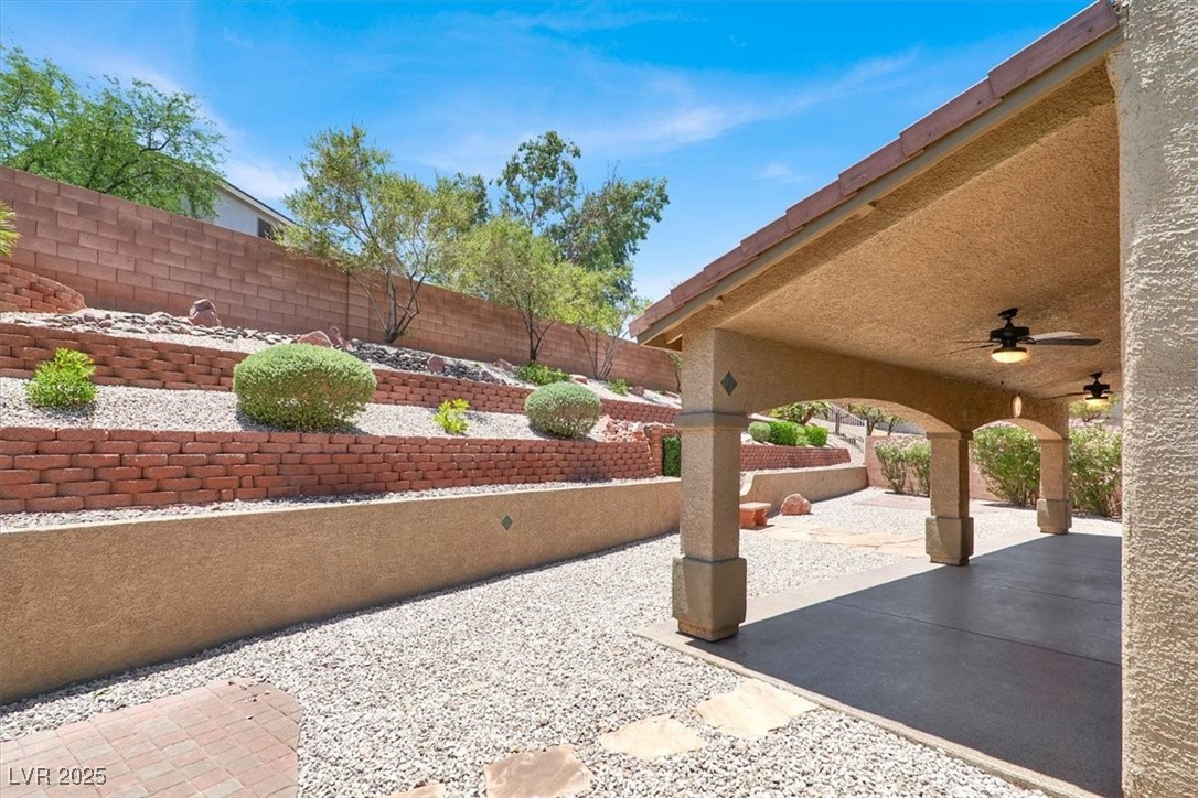 636 Pacific Cascades Drive Henderson, NV 89012 - Photo 42 of 51 Fenced backyard featuring a ceiling fan and a patio
