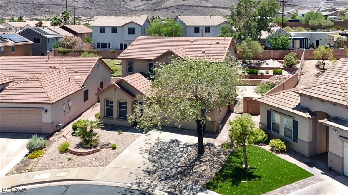 636 Pacific Cascades Drive Henderson, NV 89012 - Photo 43 of 51 Aerial perspective of suburban area with a mountainous background