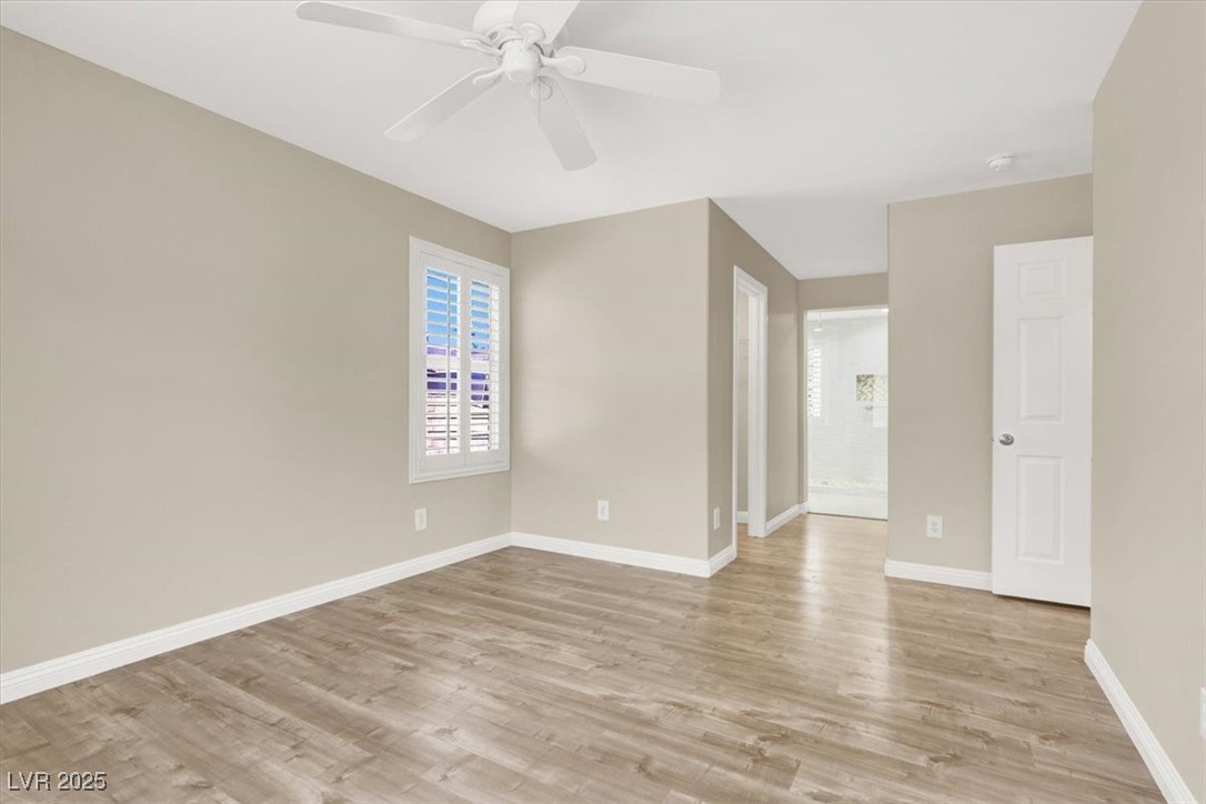 636 Pacific Cascades Drive Henderson, NV 89012 - Photo 6 of 51 Spare room with light wood-style flooring and ceiling fan