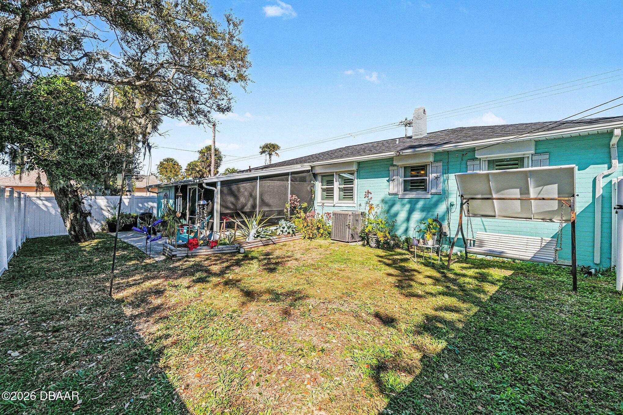 302 Riverside Drive Holly Hill, FL 32117 - Photo 20 of 23 a view of a house with backyard and sitting area