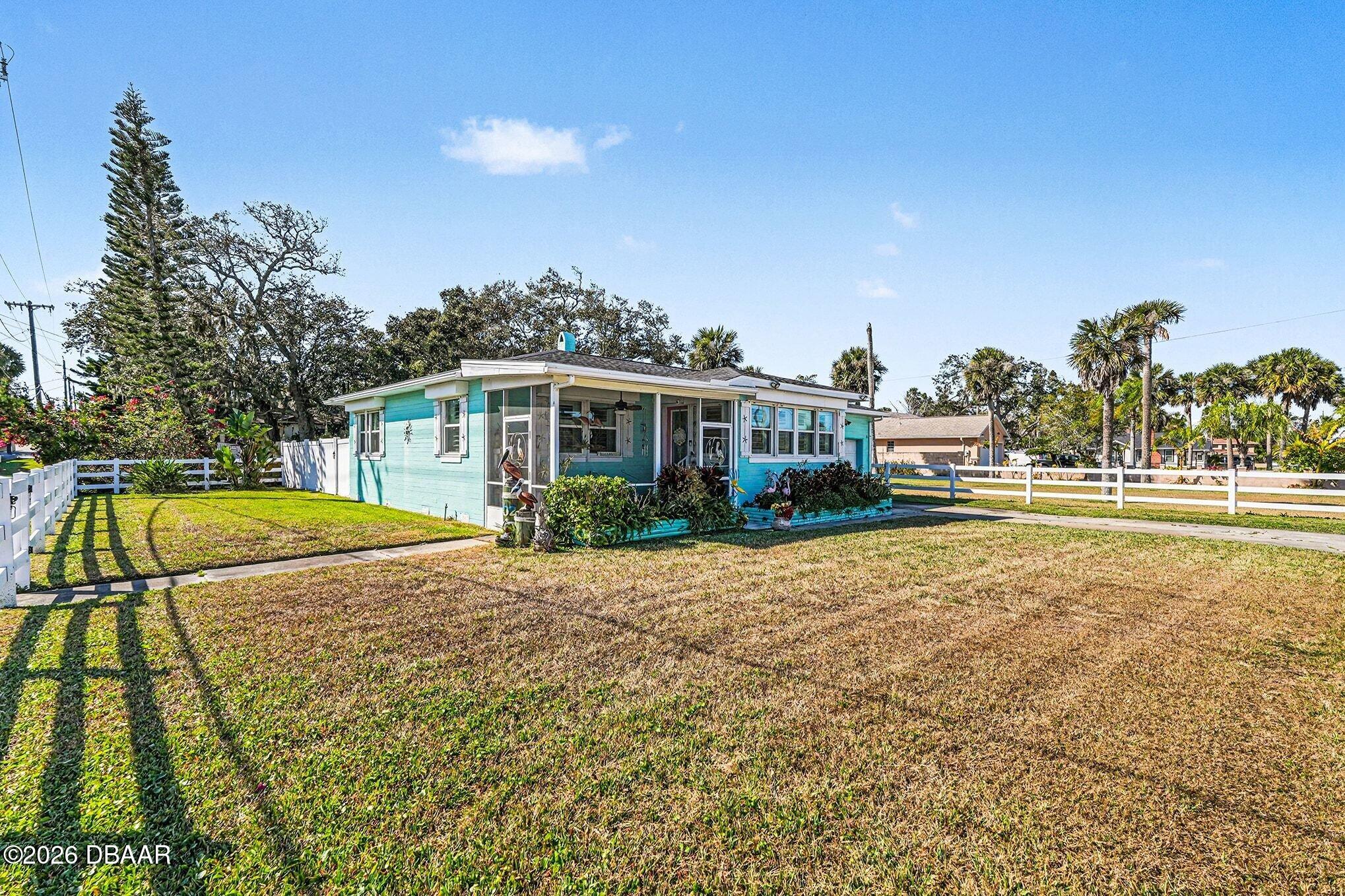 302 Riverside Drive Holly Hill, FL 32117 - Photo 2 of 23 a view of a house with swimming pool
