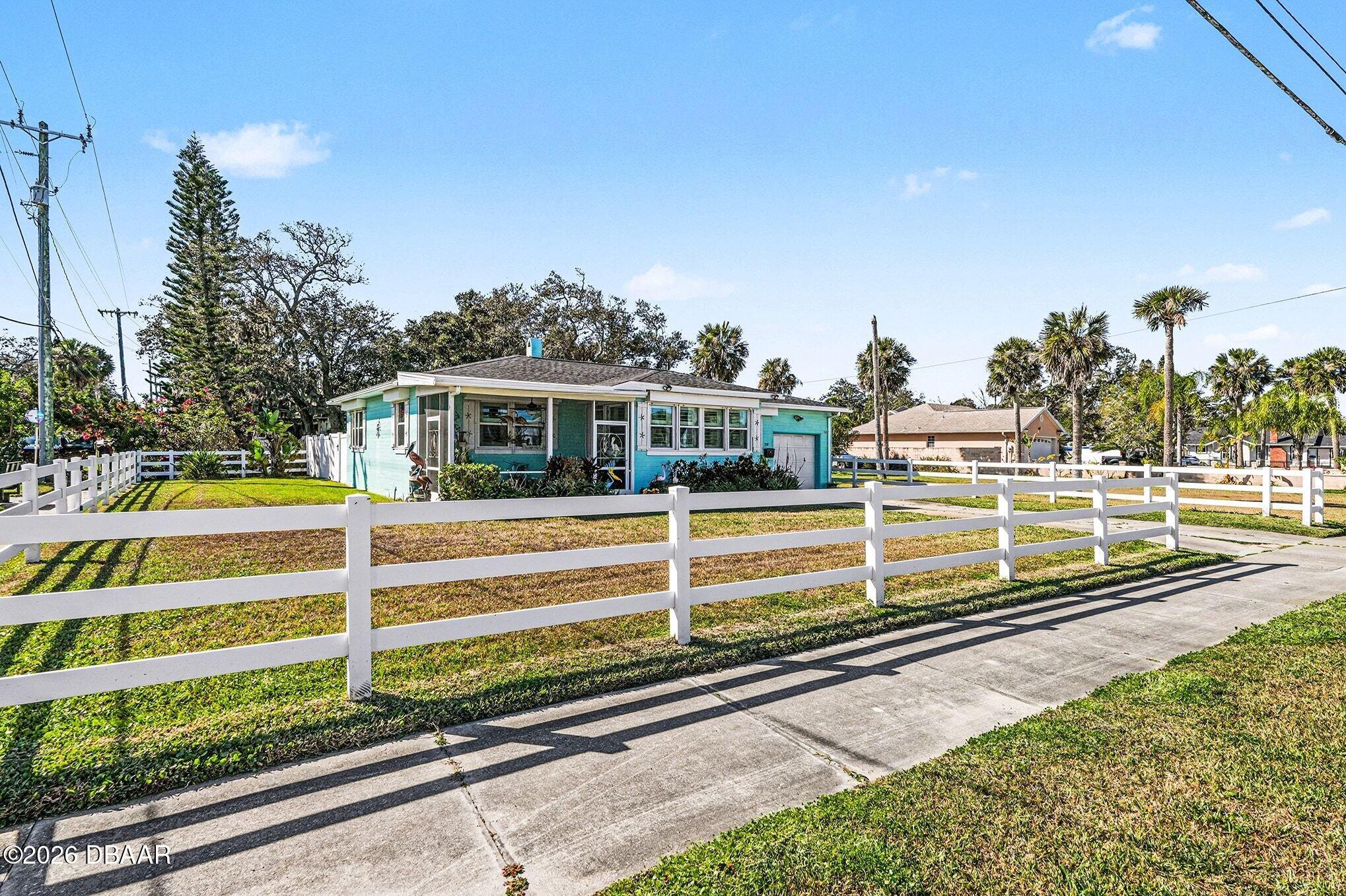302 Riverside Drive Holly Hill, FL 32117 - Photo 4 of 23 a view of a house with a yard