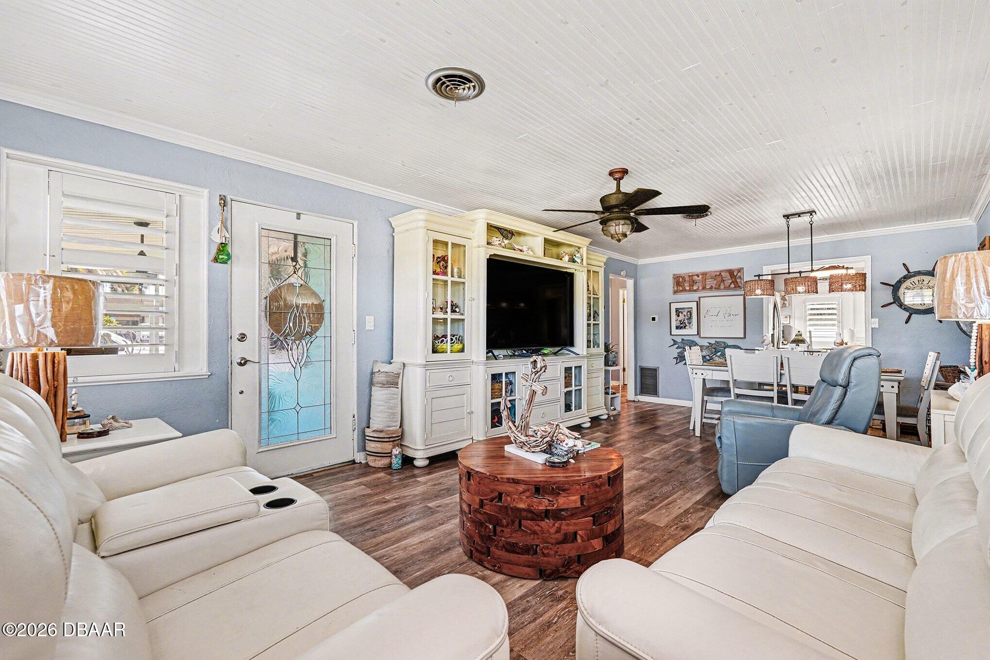 302 Riverside Drive Holly Hill, FL 32117 - Photo 5 of 23 a living room with furniture and a flat screen tv