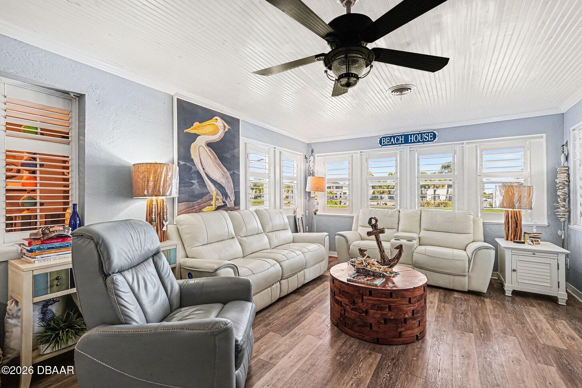 302 Riverside Drive Holly Hill, FL 32117 - Photo 6 of 23 a living room with furniture or couch and a chandelier