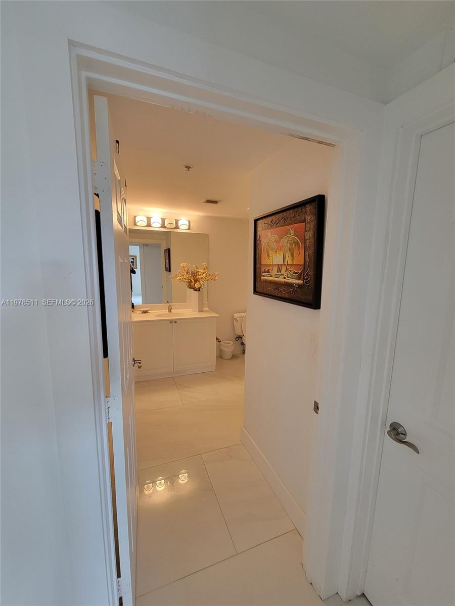888 Douglas Road, Unit 1110 Coral Gables, FL 33134 - Photo 19 of 28 a view of a hallway