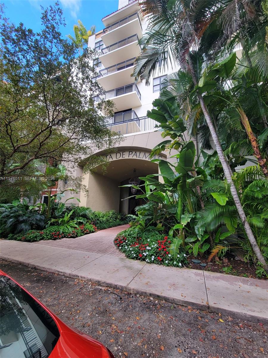 888 Douglas Road, Unit 1110 Coral Gables, FL 33134 - Photo 2 of 28 a front view of a house with plants