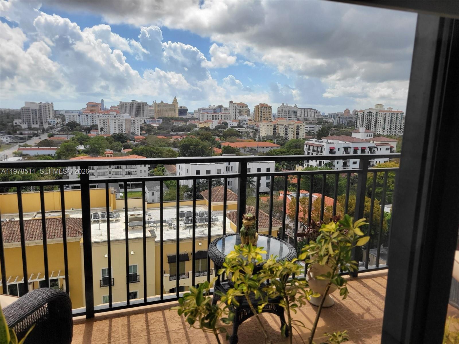 888 Douglas Road, Unit 1110 Coral Gables, FL 33134 - Photo 23 of 28 a view of a balcony with city view