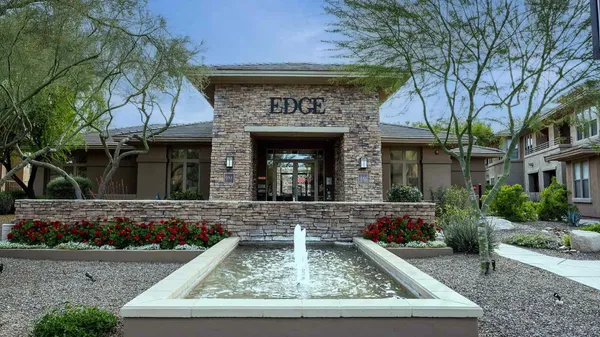 front view of house with potted plants