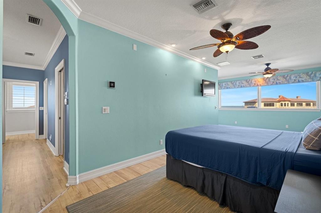 2 Mar Azul North Ponce Inlet, FL 32127 - Photo 68 of 98 a room with a bed and a ceiling fan