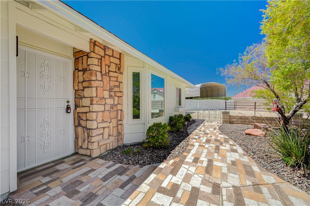 7631 Bermuda Road Las Vegas, NV 89123 - Photo 9 of 64 A stone veneer facade and a charming paver pathway welcome you to this inviting residence.