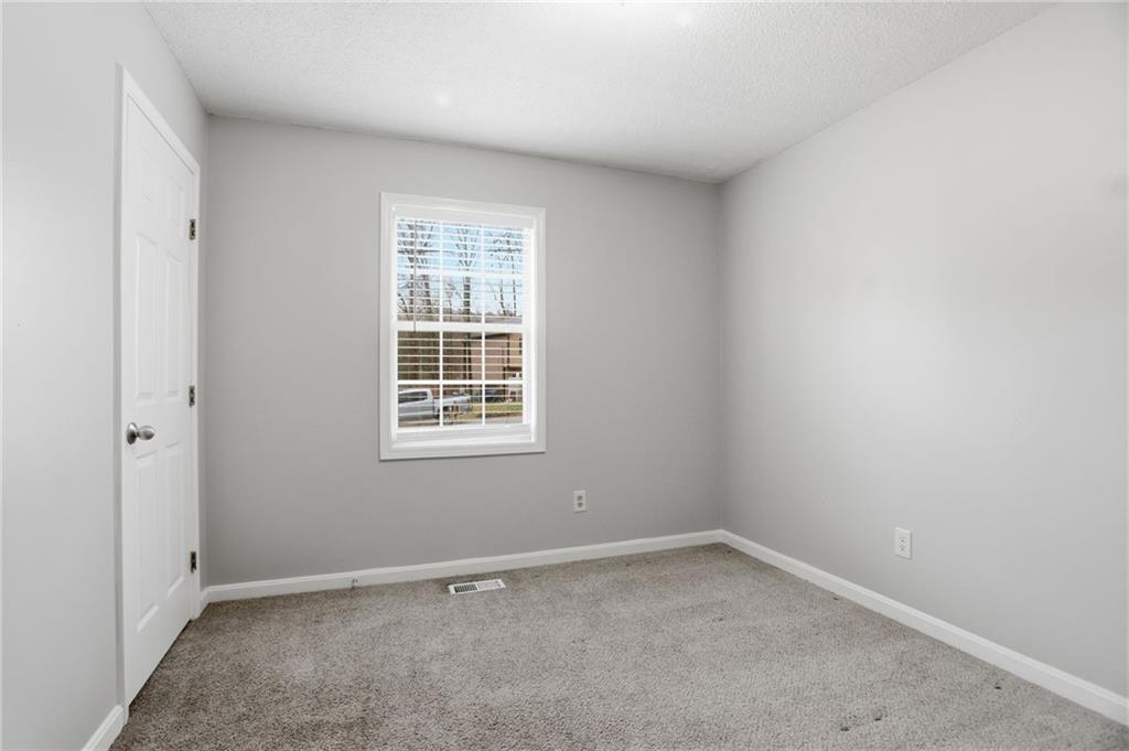 113 Hampton Drive Dallas, GA 30132 - Photo 15 of 30 an empty room with a window