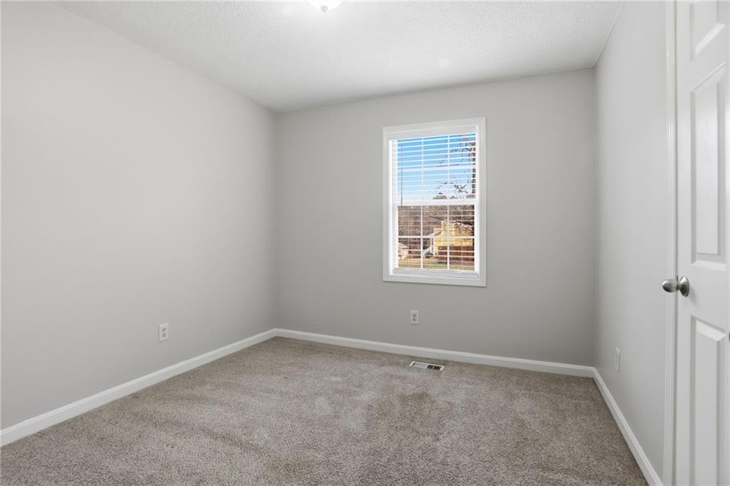 113 Hampton Drive Dallas, GA 30132 - Photo 18 of 30 an empty room with a window