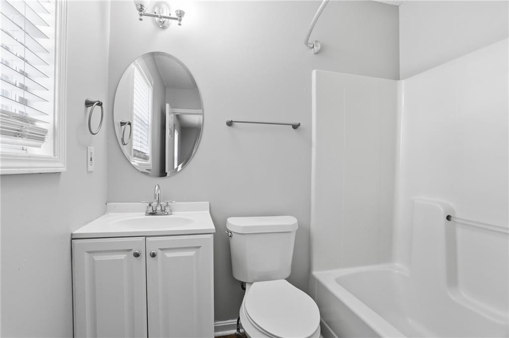113 Hampton Drive Dallas, GA 30132 - Photo 19 of 30 a bathroom with a toilet sink and mirror