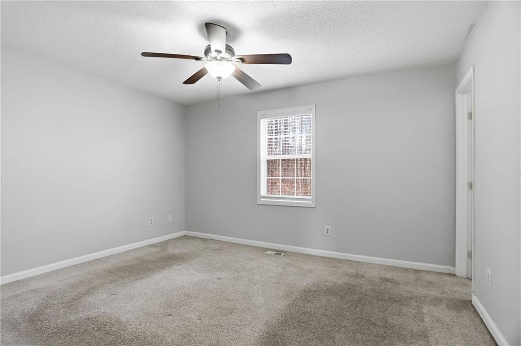 113 Hampton Drive Dallas, GA 30132 - Photo 20 of 30 an empty room with windows and fan