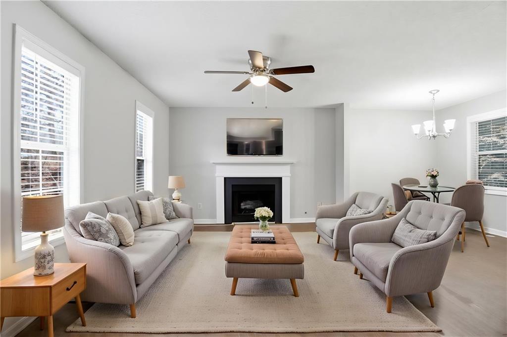 113 Hampton Drive Dallas, GA 30132 - Photo 3 of 30 a living room with furniture a fireplace and a large window
