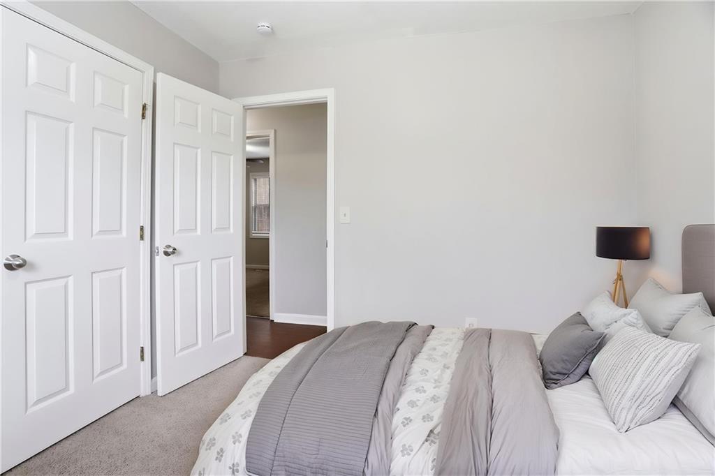 113 Hampton Drive Dallas, GA 30132 - Photo 6 of 30 a bedroom with a bed and a window