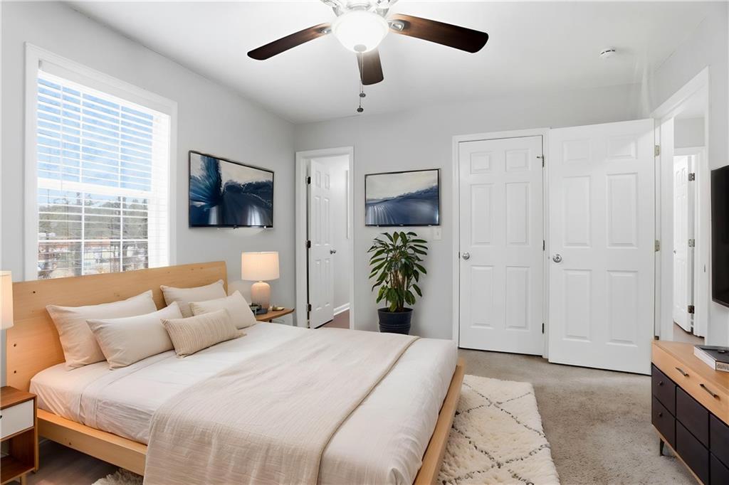 113 Hampton Drive Dallas, GA 30132 - Photo 7 of 30 a bedroom with a bed and a flat screen tv