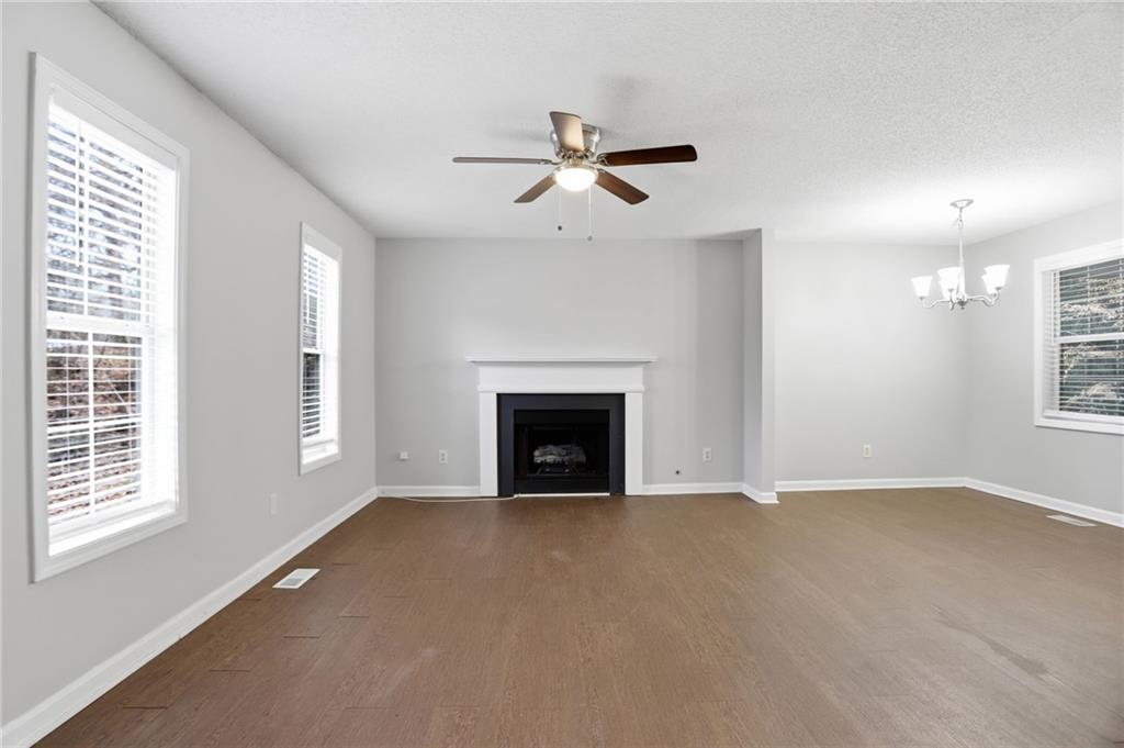 113 Hampton Drive Dallas, GA 30132 - Photo 8 of 30 a view of an empty room with a window and fireplace