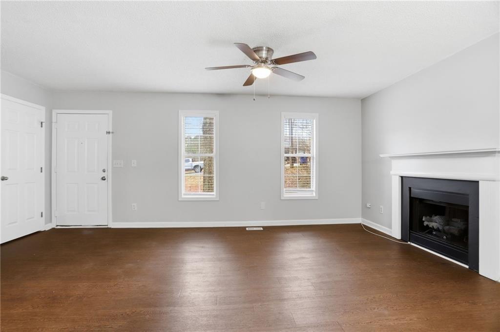 113 Hampton Drive Dallas, GA 30132 - Photo 9 of 30 a view of livingroom with hardwood floor and a ceiling fan