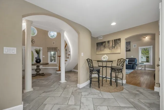 a view of a livingroom with furniture and a potted plant
