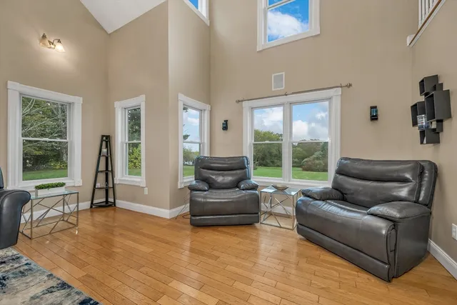 a bathroom with a granite countertop sink a toilet and a mirror