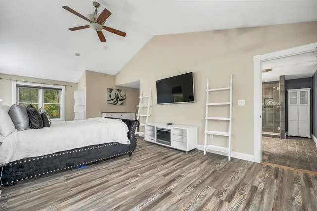 a bathroom with a shower sink double vanity and mirror