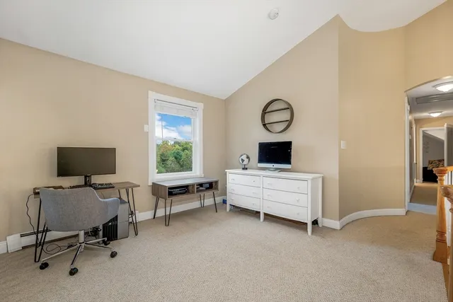 a bed room with a bed and a window