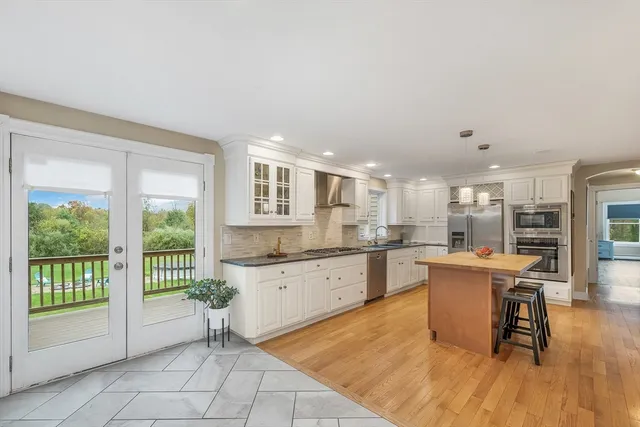 a kitchen that has a sink and a stove