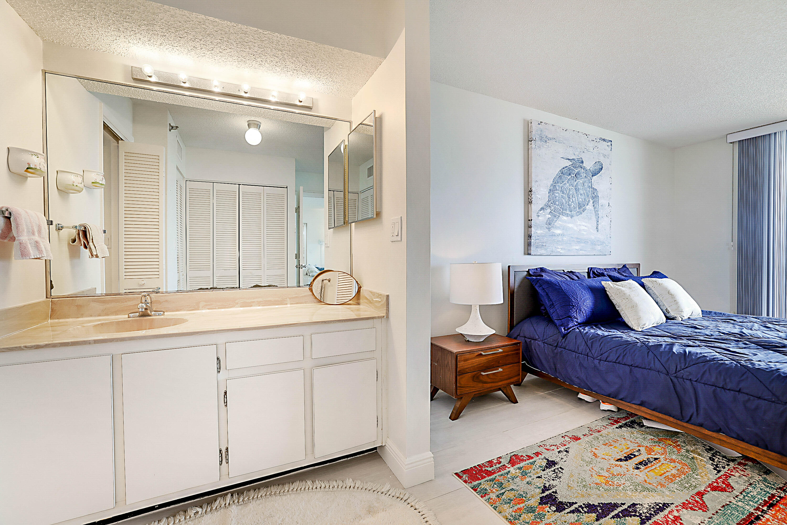 100 Ocean Trail Way, Unit 1003 Jupiter, FL 33477 - Photo 19 of 33 a living room with furniture and a mirror