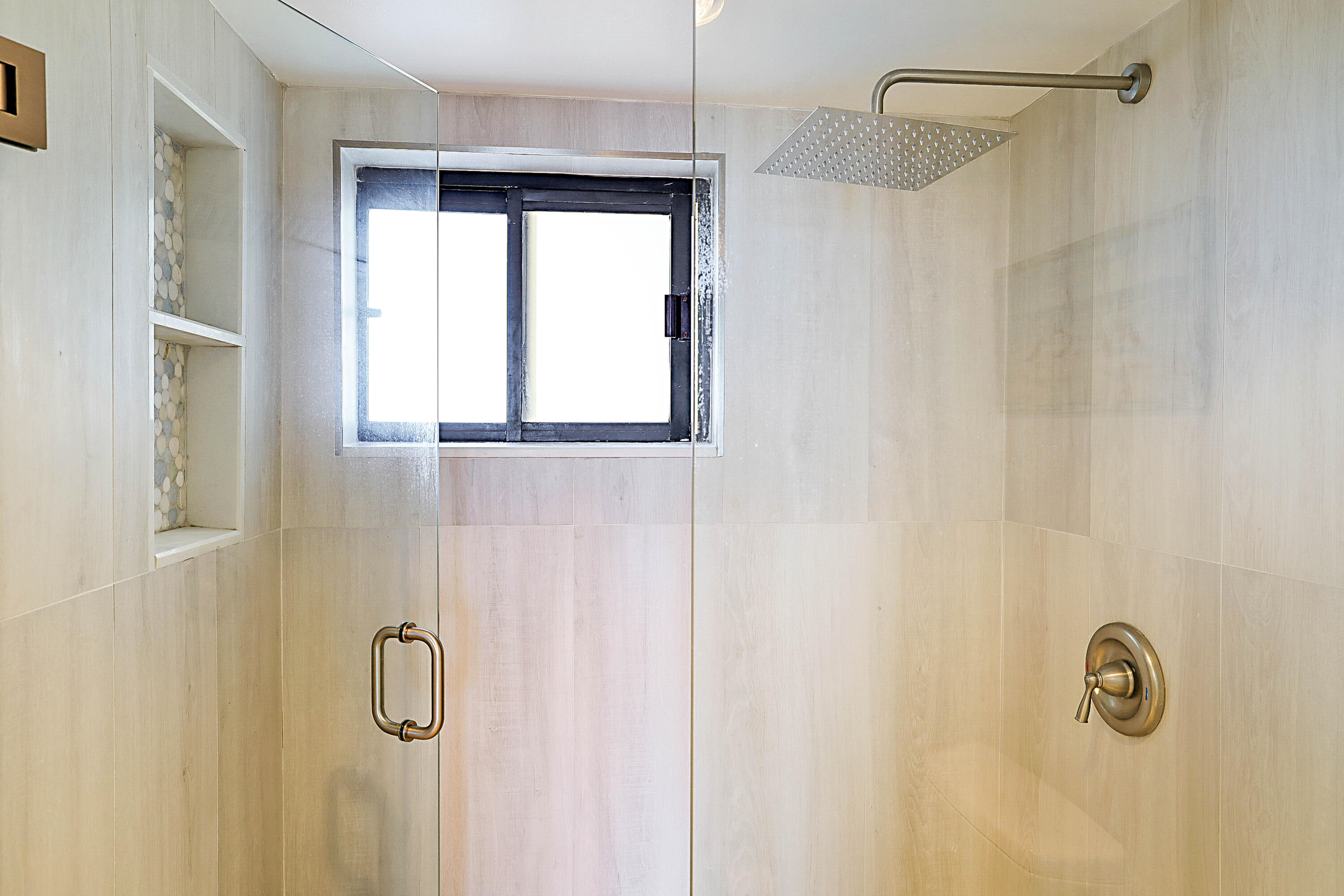 100 Ocean Trail Way, Unit 1003 Jupiter, FL 33477 - Photo 21 of 33 a bathroom with a shower