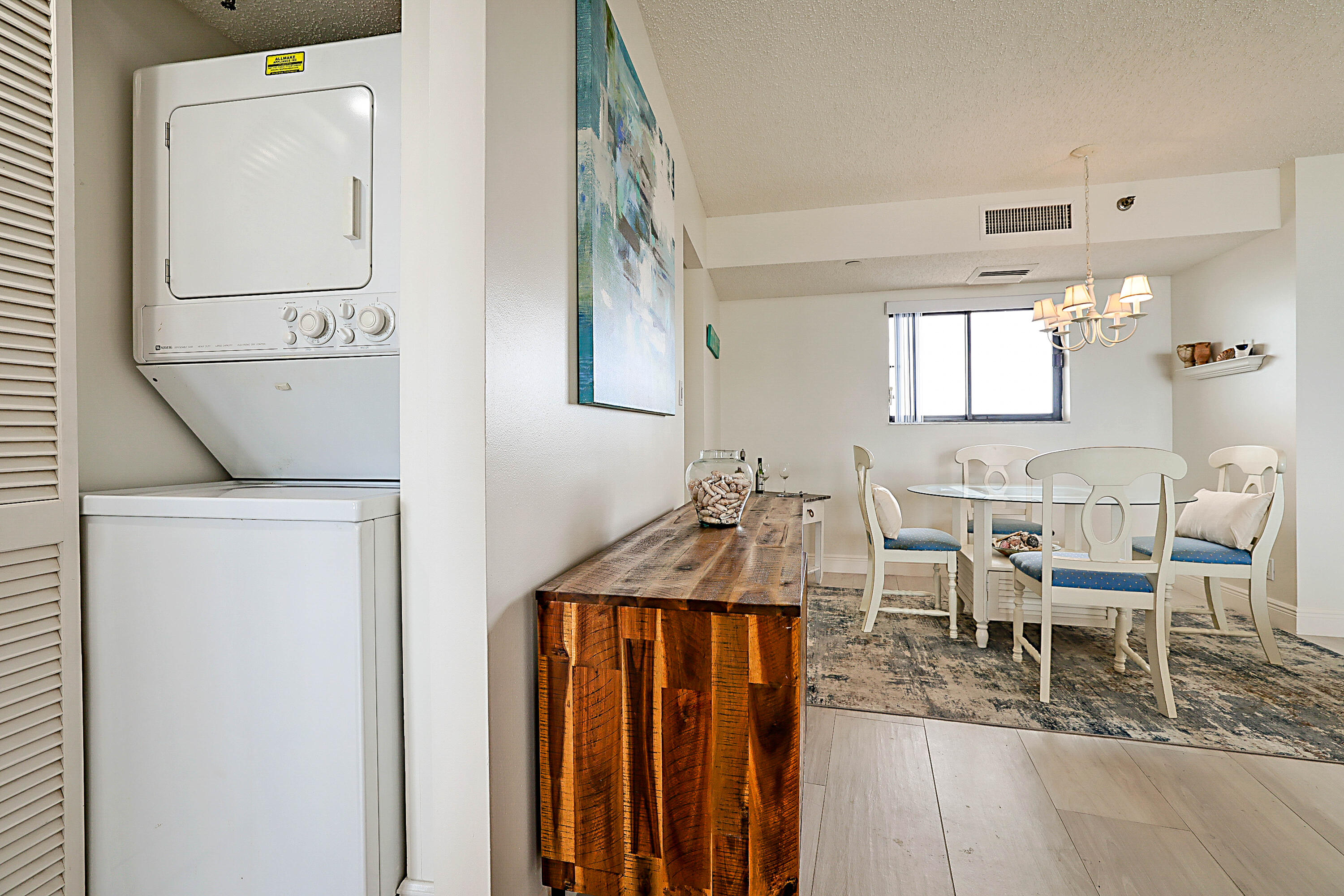 100 Ocean Trail Way, Unit 1003 Jupiter, FL 33477 - Photo 23 of 33 a dining room with furniture and window