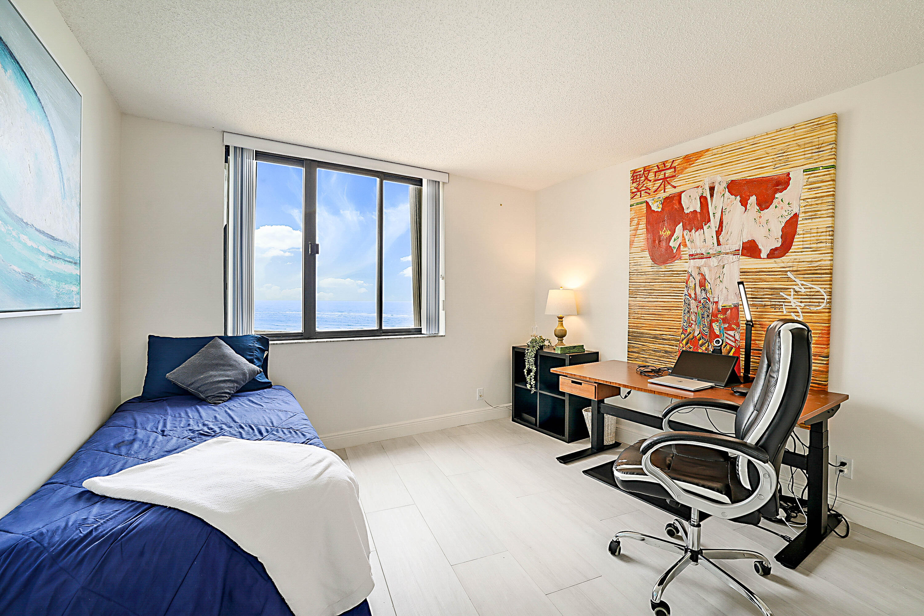 100 Ocean Trail Way, Unit 1003 Jupiter, FL 33477 - Photo 24 of 33 a bedroom with a bed and a window