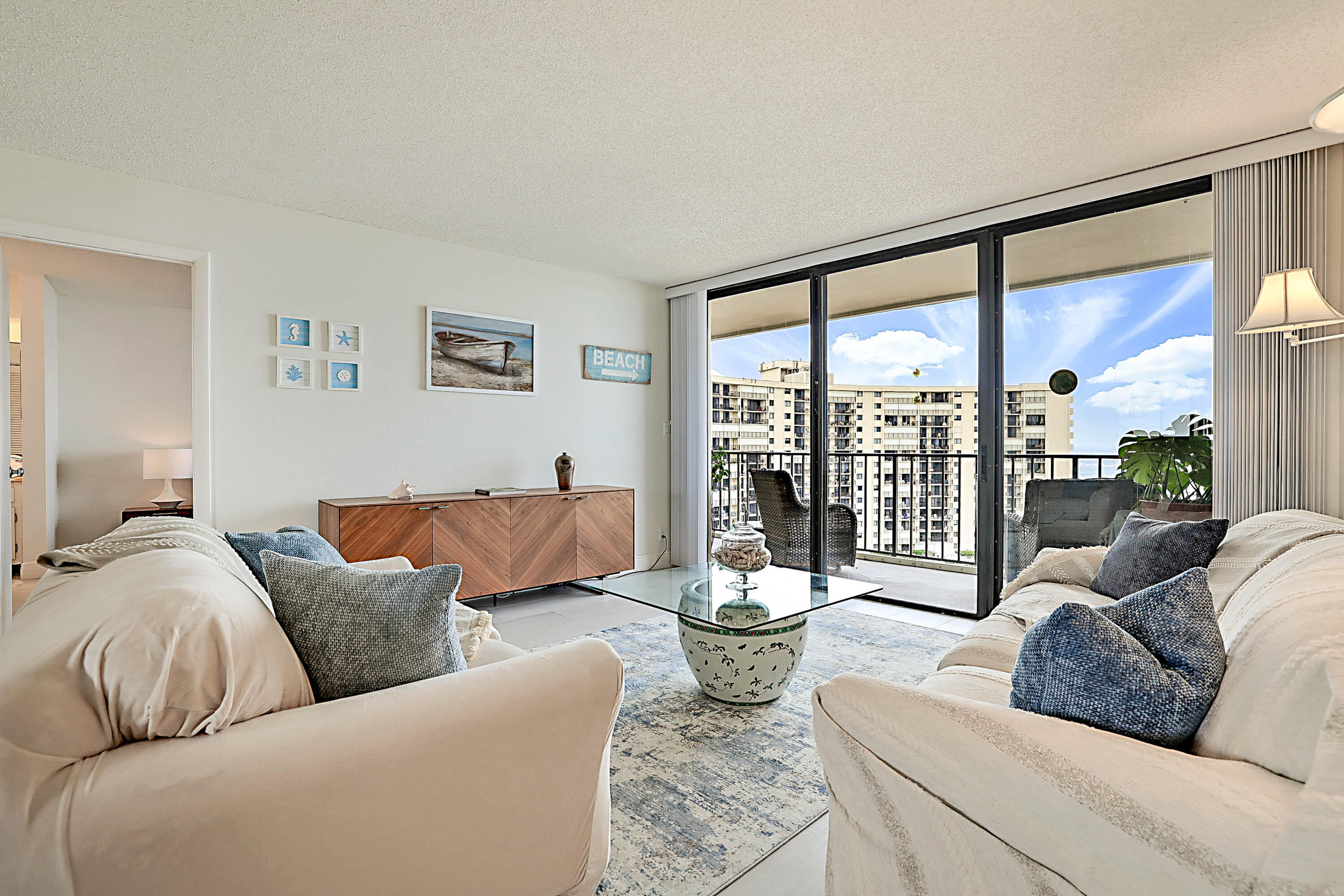 100 Ocean Trail Way, Unit 1003 Jupiter, FL 33477 - Photo 3 of 33 a living room with furniture and a large window