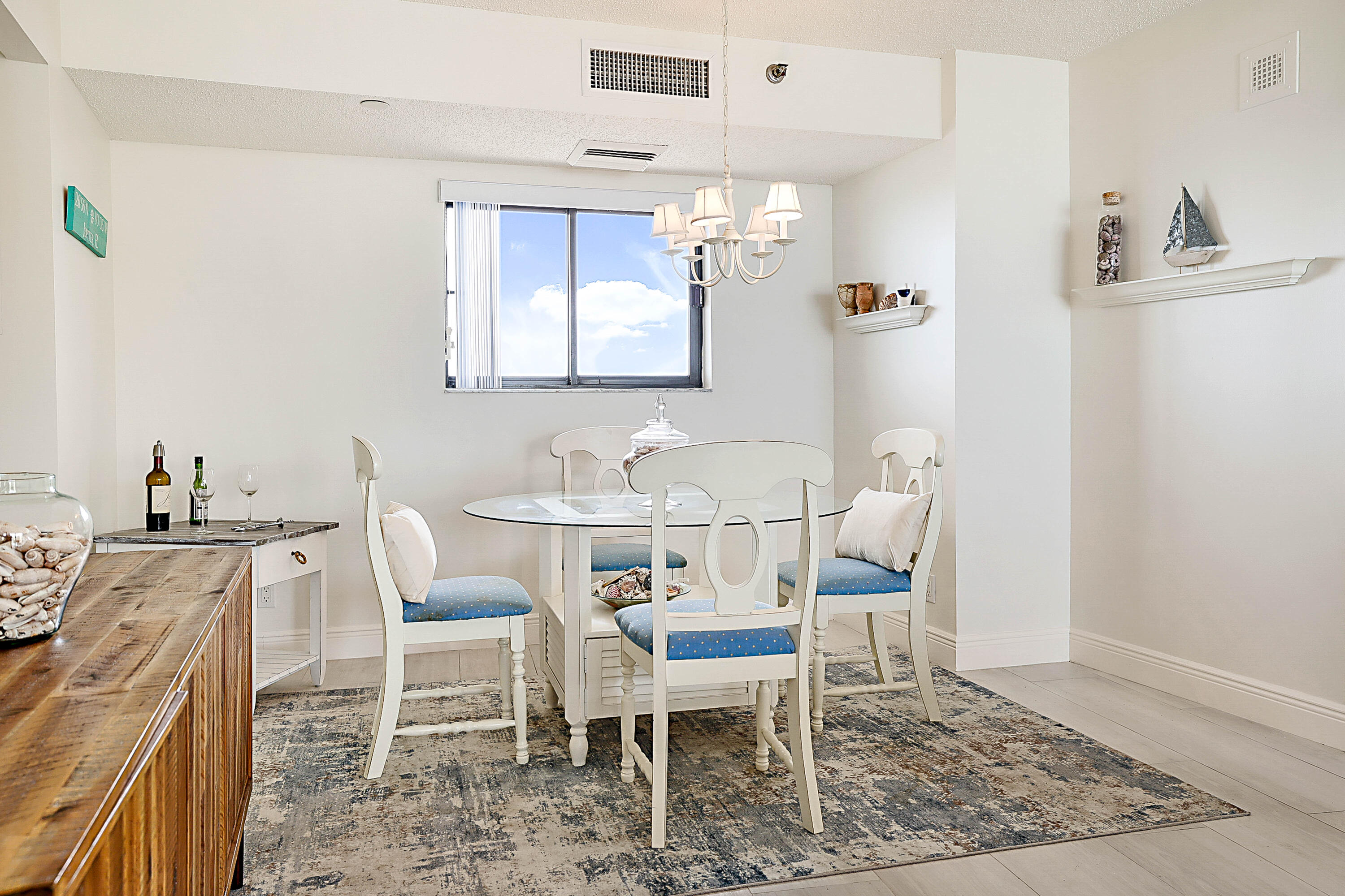 100 Ocean Trail Way, Unit 1003 Jupiter, FL 33477 - Photo 7 of 33 a dining room with furniture and window