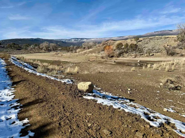 a view of a large building with an ocean