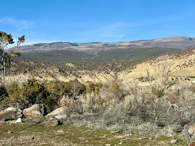 a view of a lake with mountains in the background