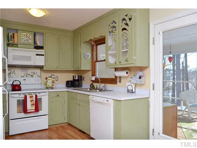 3325 Castlegate Drive Raleigh, NC 27616 - Photo 10 of 25 a kitchen with stainless steel appliances granite countertop a sink and cabinets