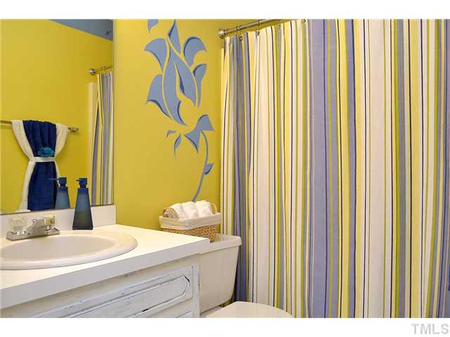 3325 Castlegate Drive Raleigh, NC 27616 - Photo 11 of 25 a bathroom with a sink and a mirror
