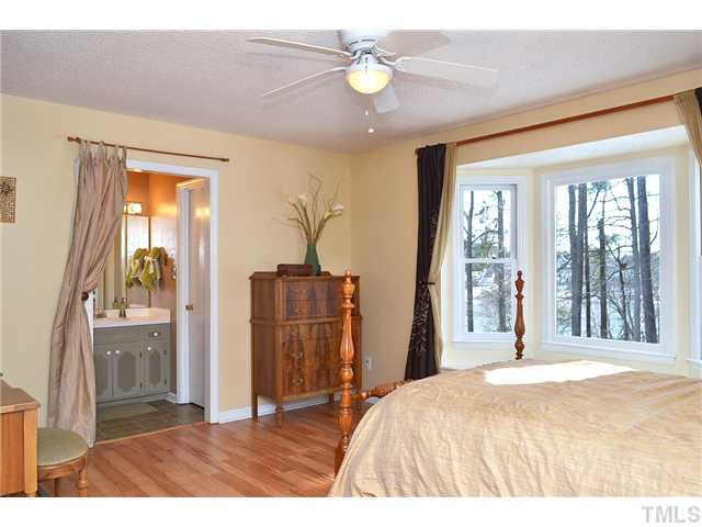 3325 Castlegate Drive Raleigh, NC 27616 - Photo 14 of 25 a bedroom with a bed and a window