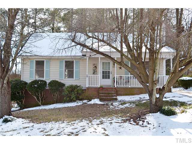 3325 Castlegate Drive Raleigh, NC 27616 - Photo 2 of 25 a view of a house with a yard covered with snow in the background