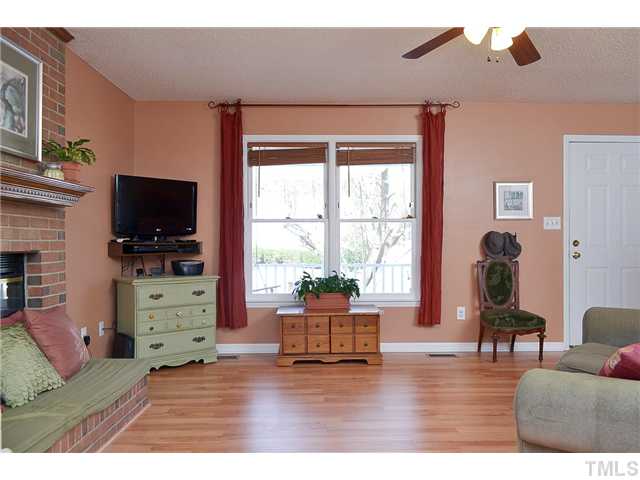 3325 Castlegate Drive Raleigh, NC 27616 - Photo 5 of 25 a living room with furniture and a flat screen tv