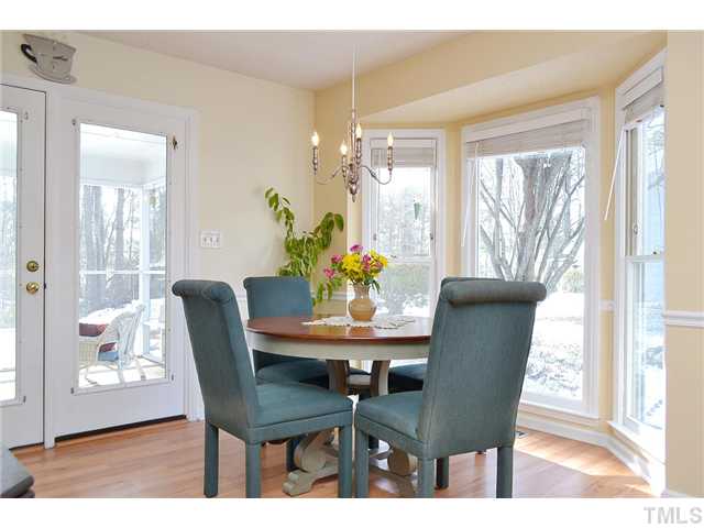 3325 Castlegate Drive Raleigh, NC 27616 - Photo 7 of 25 a dining room with furniture and wooden floor