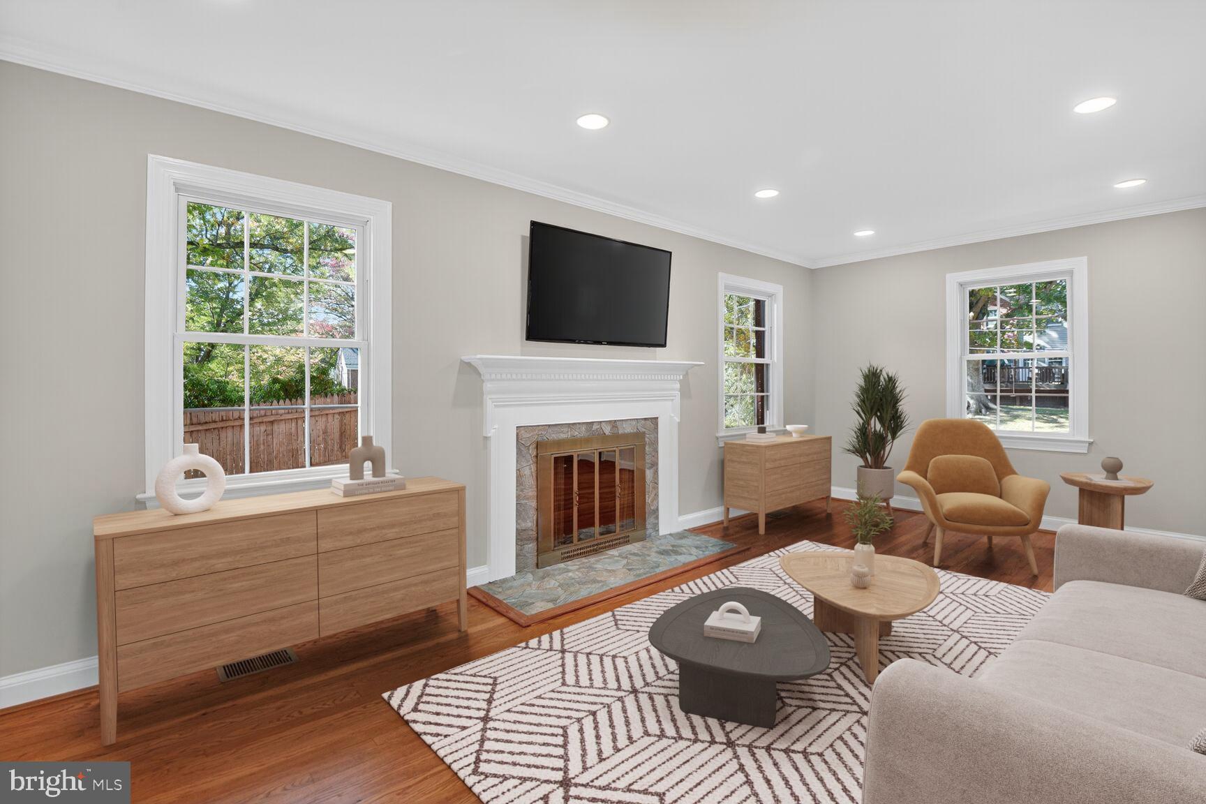 302 Penwood Road Silver Spring, MD 20901 - Photo 11 of 44 a living room with furniture and a fireplace