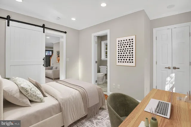 a bedroom with a bed and a table