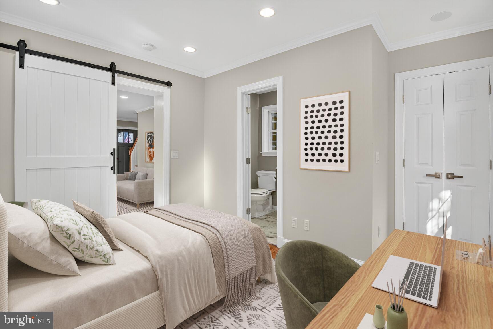 302 Penwood Road Silver Spring, MD 20901 - Photo 12 of 44 a bedroom with a bed and a table