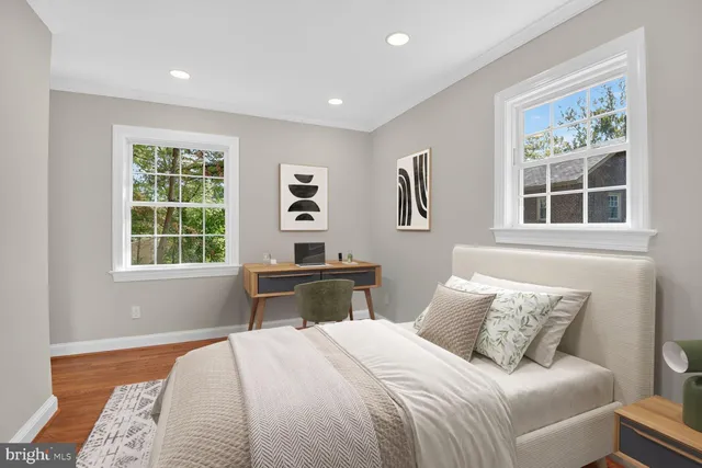 a bedroom with a large bed and a window