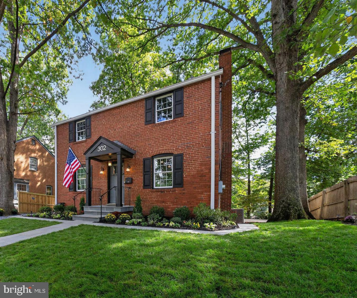 302 Penwood Road Silver Spring, MD 20901 - Photo 2 of 44 front view of house with a yard