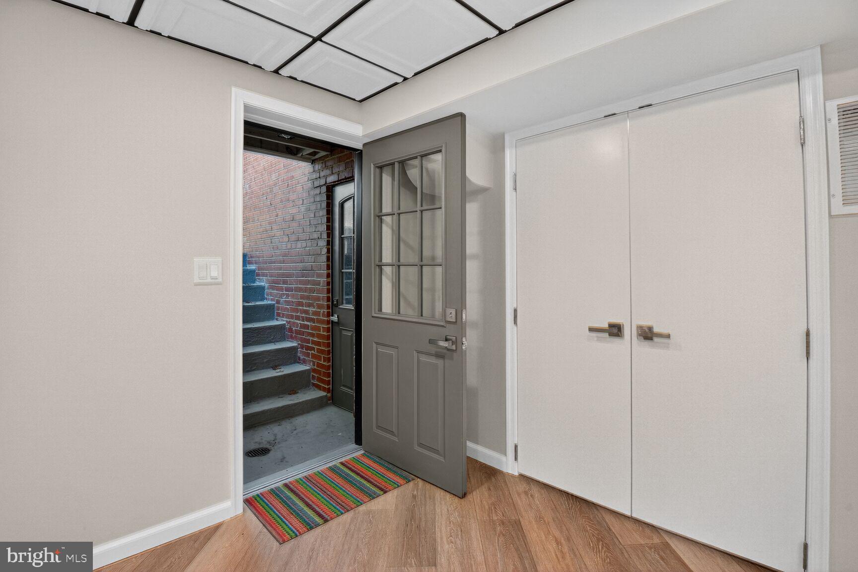 302 Penwood Road Silver Spring, MD 20901 - Photo 35 of 44 a view of a hallway with wooden floor and entryway
