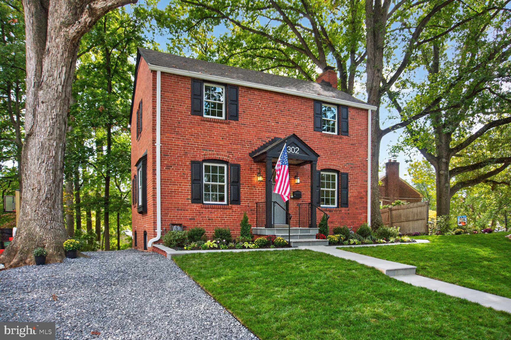 302 Penwood Road Silver Spring, MD 20901 - Photo 4 of 44 front view of a house with a yard